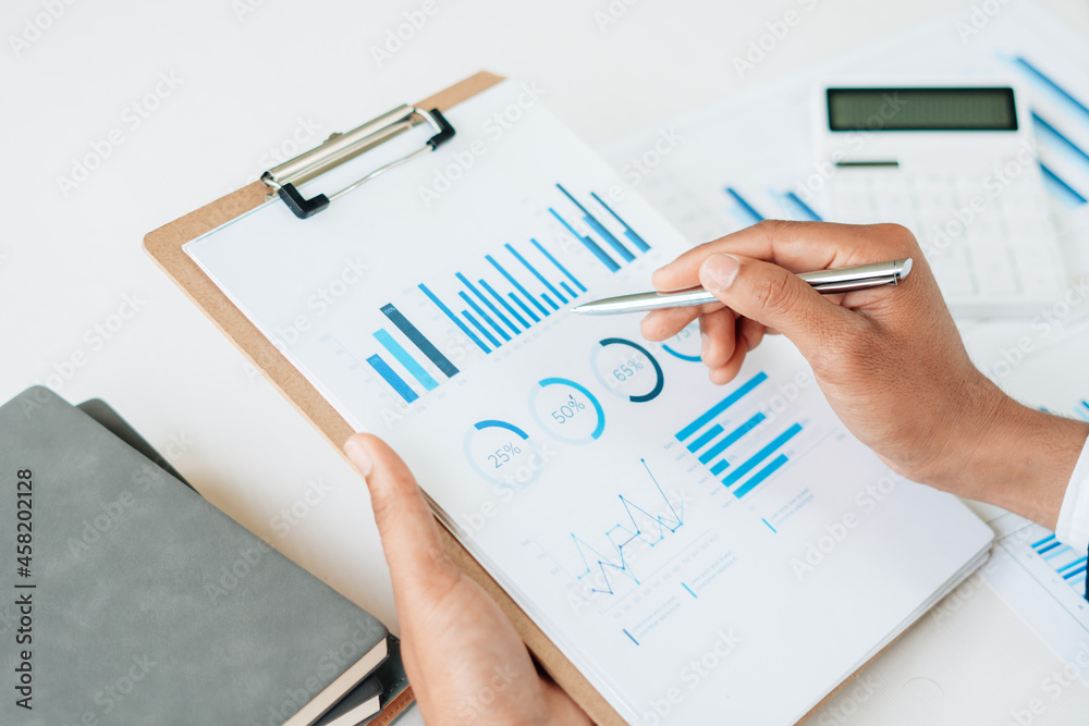 businessman working data document graph chart report marketing research development planning managem