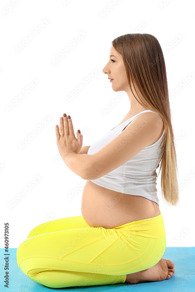 年轻孕妇在白色背景下做瑜伽