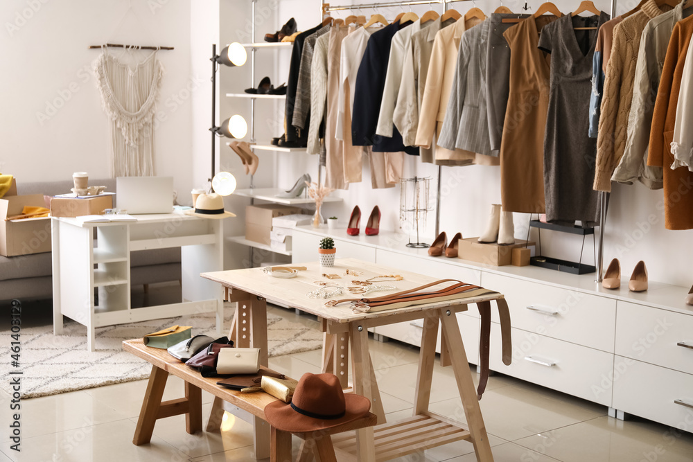 Stylish interior of modern store with clothes and accessories