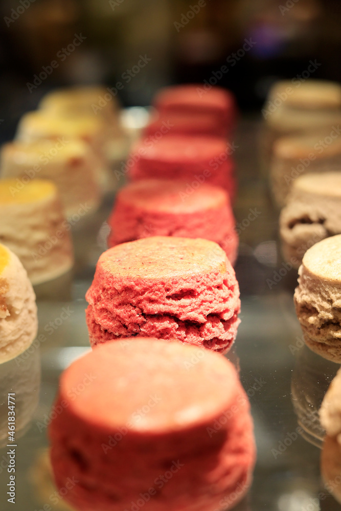 assortment of cup cake and macaron sold in bakery