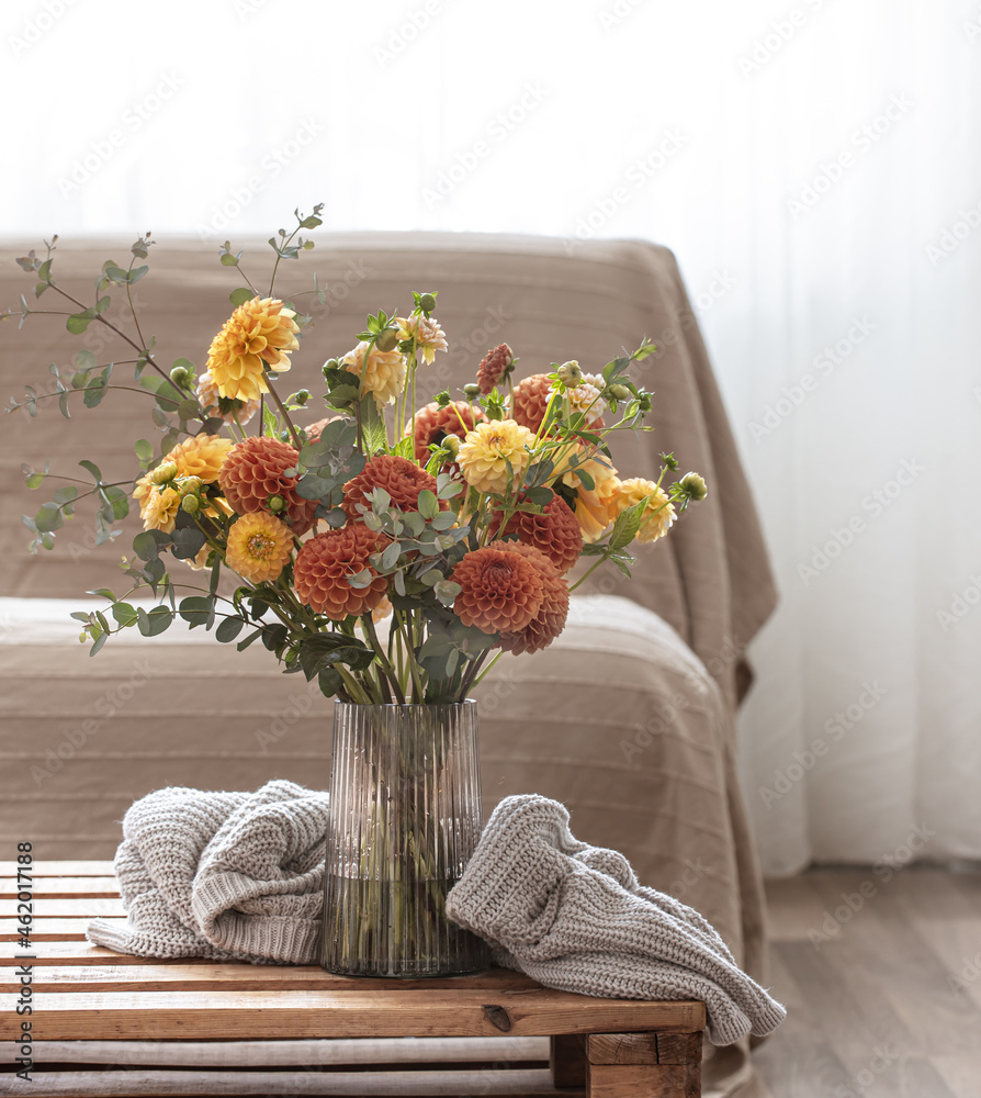 Bouquet of chrysanthemums in a vase in the interior of the room, copy space.