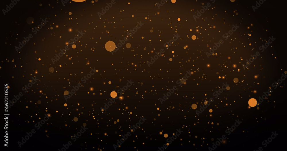 Image of warm glowing orange spots floating on brown background
