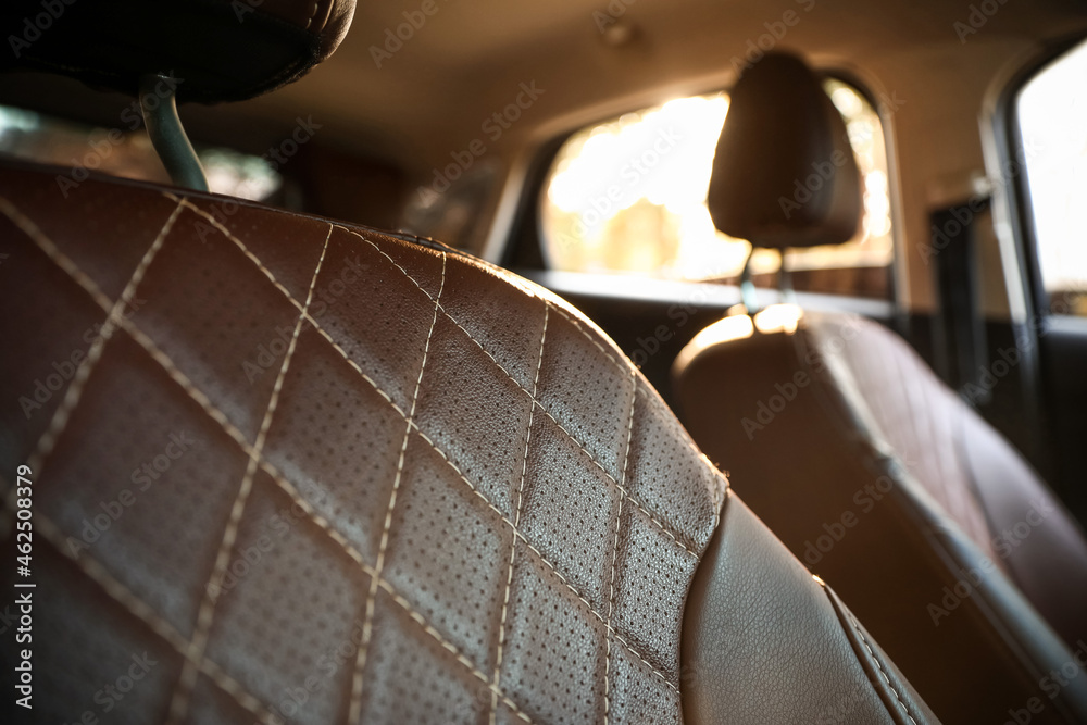 Brown leather seat in modern car, closeup