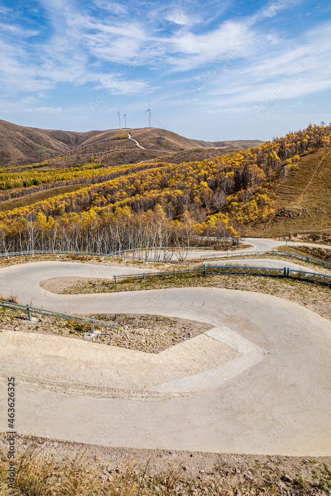 Curved road and beautiful mountain natural scenery in autumn season.Road and mountain background.