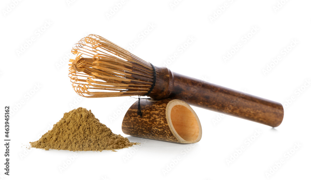 Heap of hojicha powder and chasen on white background
