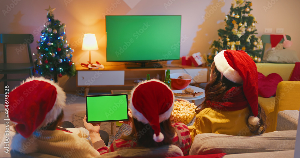 women watch TV while Christmas