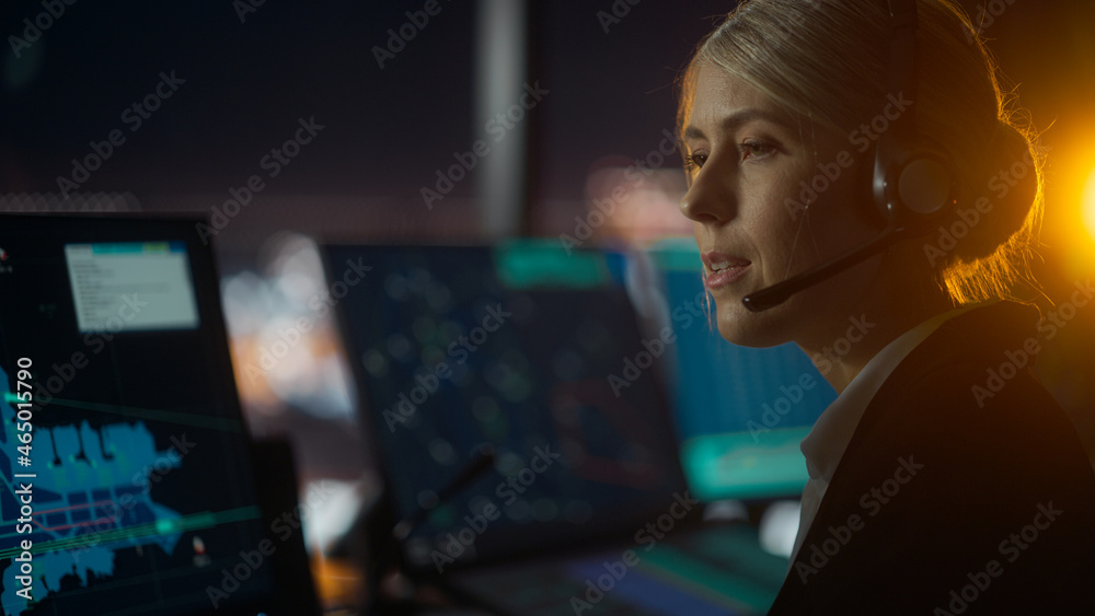 Close Up Female Portrait of Air Traffic Controller with Headset Talk on a Call in Airport Tower at N