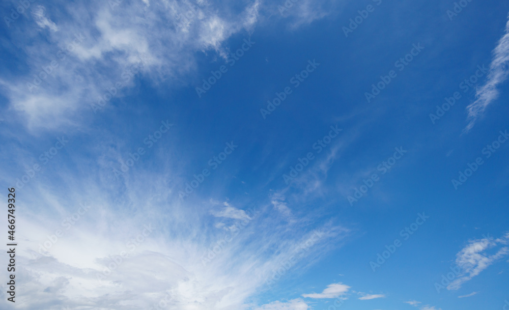 White cumulus clouds formation in blue sky background