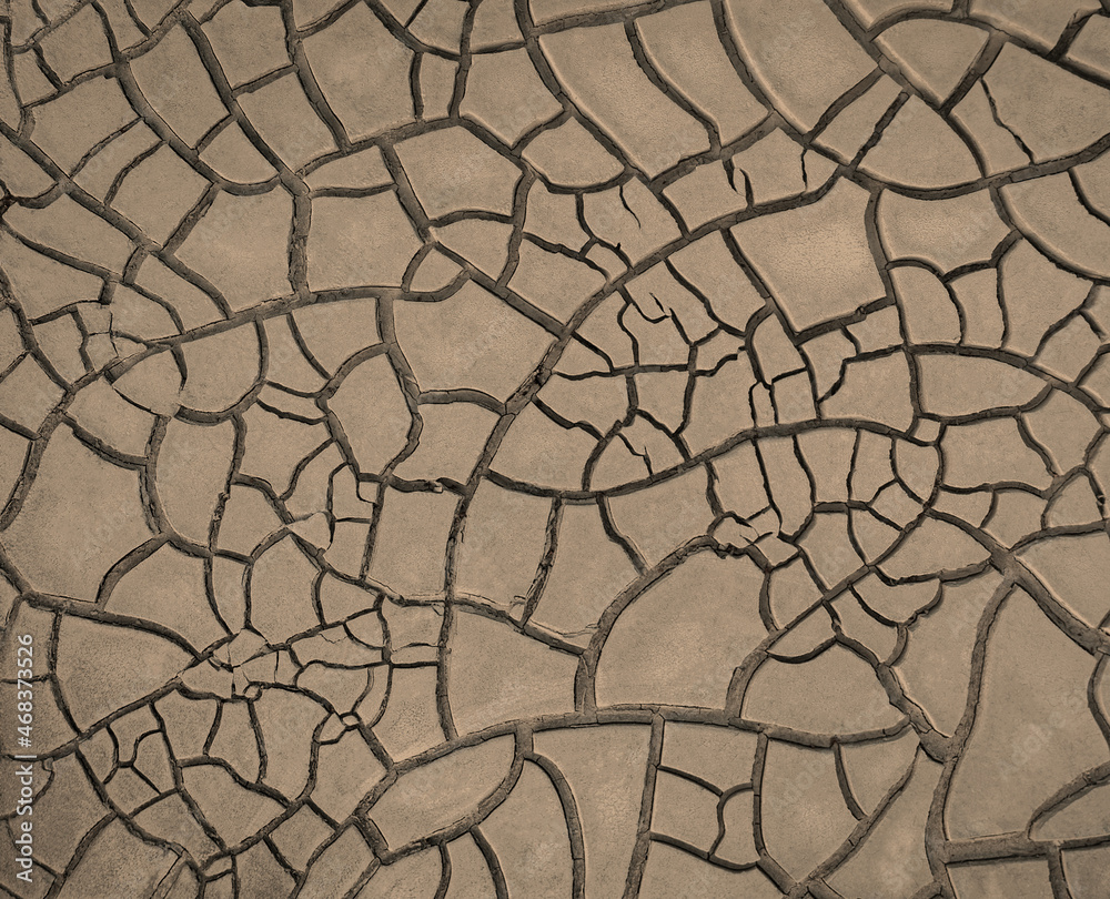 Cracked brown mud, surface texture of barren land