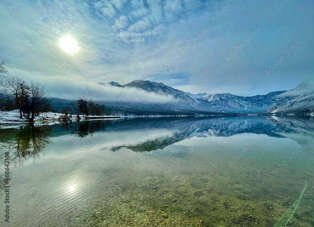 Picturesque view of the breathtaking lake Bohinj, Slovenia on a sunny winter day
