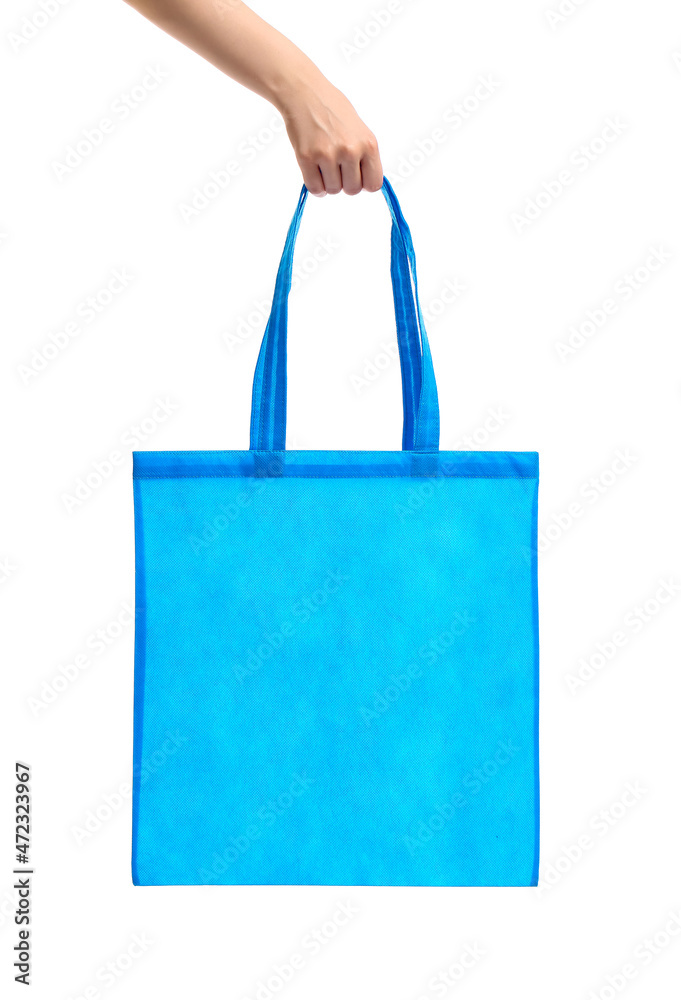 Young woman with blue eco bag on white background