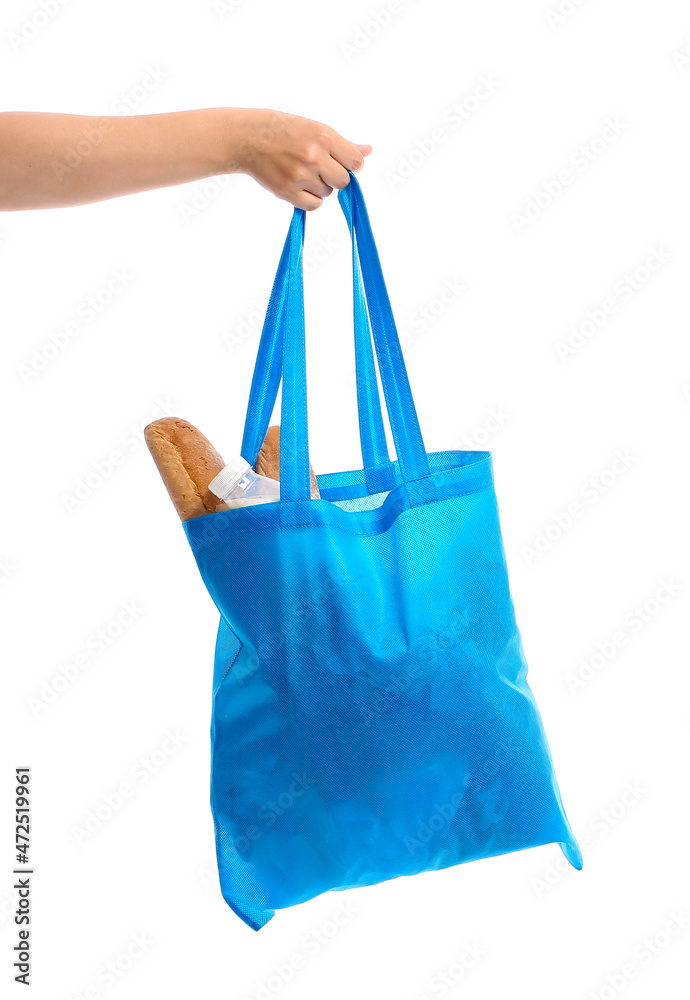Woman holding blue bag with food on white background
