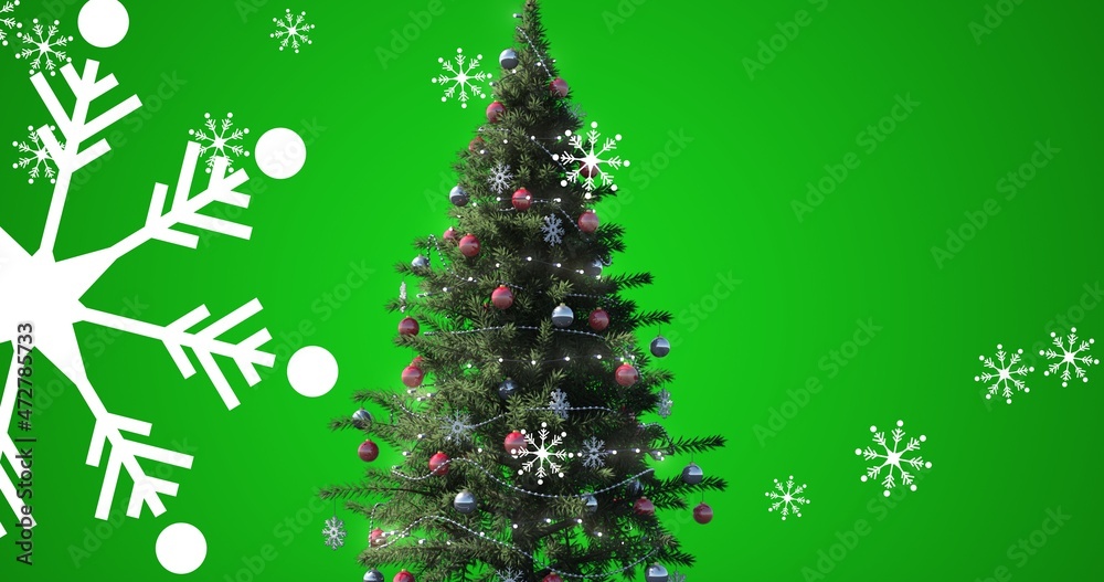 绿色背景下雪花和圣诞树的数字合成，带有复制空间