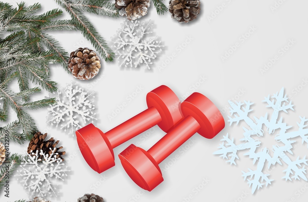 两个运动哑铃和一棵圣诞树，上面有圣诞球和雪花。