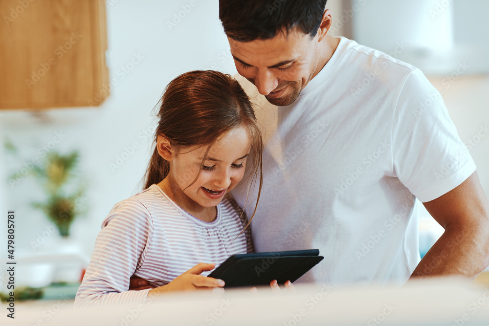 Dad and little girl using a tablet
