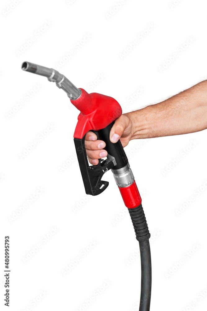 Human hand holding a gas nozzle