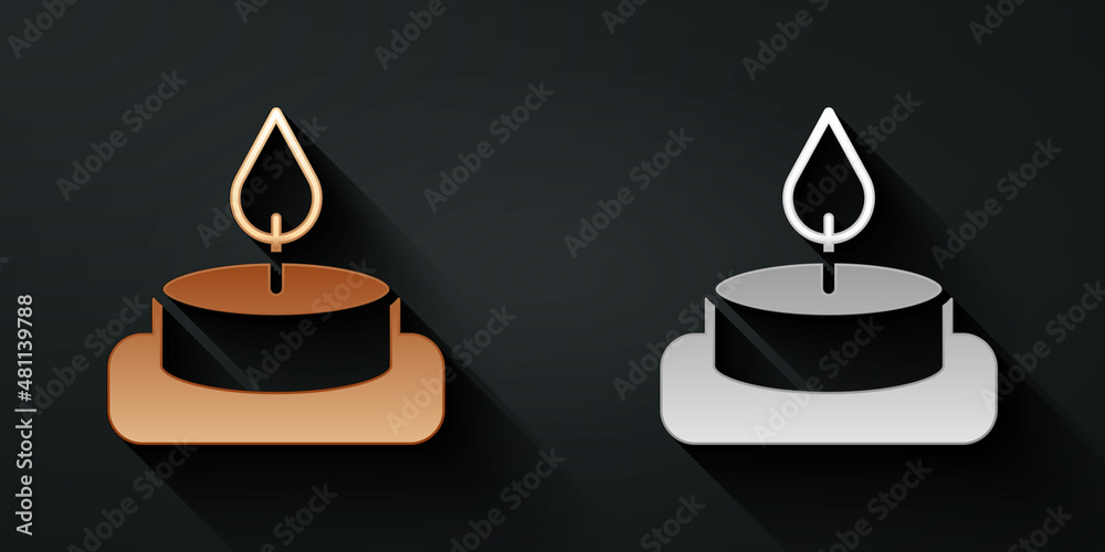 Gold and silver Aroma candle icon isolated on black background. Long shadow style. Vector