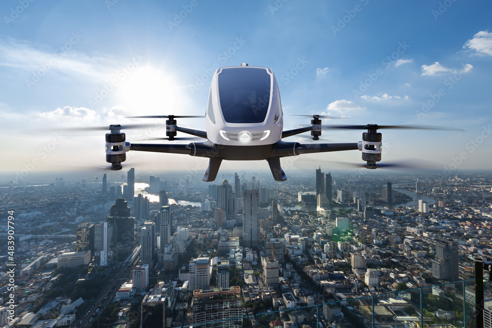 Autonomous driverless aerial vehicle flying on city background, Future transportation with 5G techno