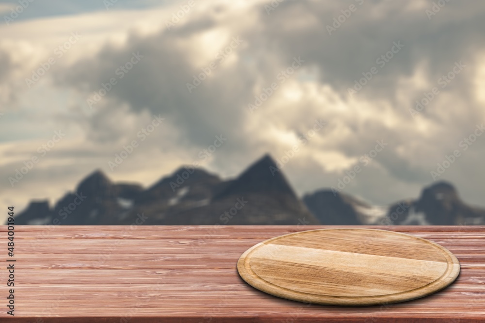 Empty wooden table with Mountain soft blurry background. Use as products display montage.