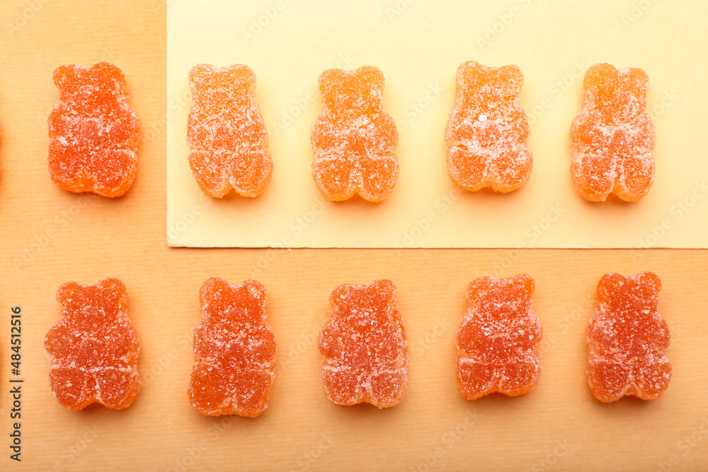 Tasty jelly bears on color background