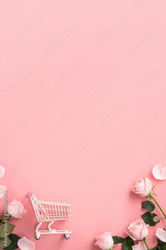情人节购物设计概念背景，粉色玫瑰花和粉色背景推车