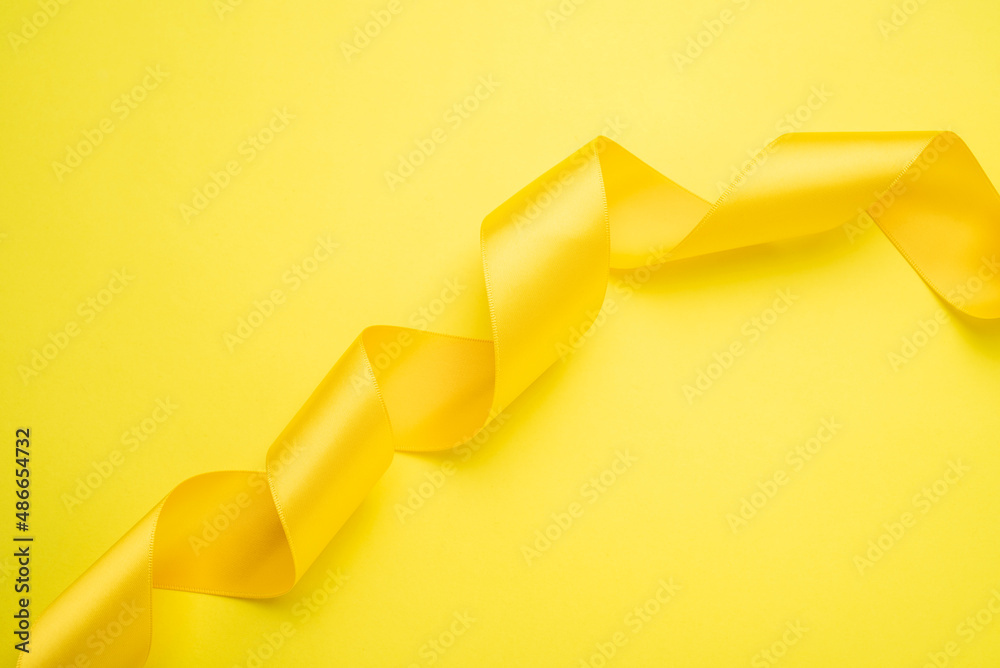 Yellow ribbon fashion poster background material