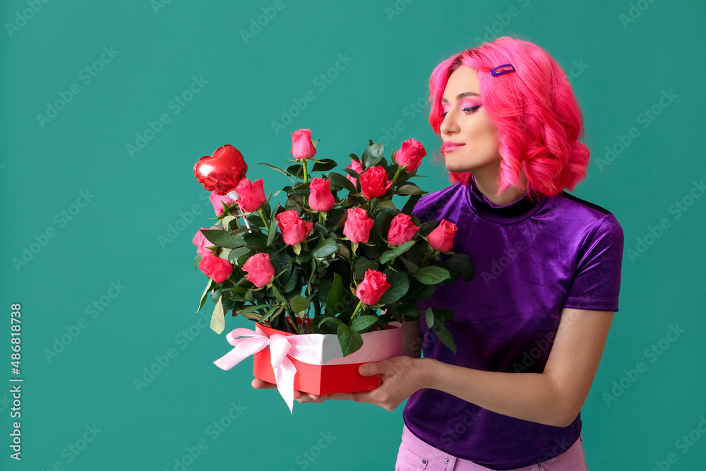 Stylish woman with bright hair and bouquet of flowers on color background. Valentines Day celebrati