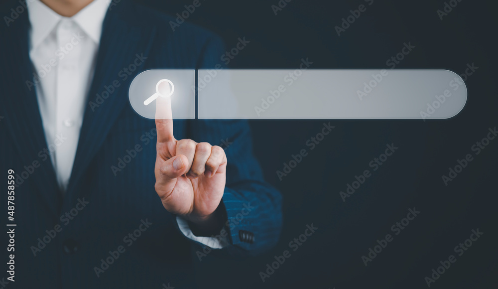 Searching Browsing Internet Data Information with blank search bar. mans hands are using a computer
