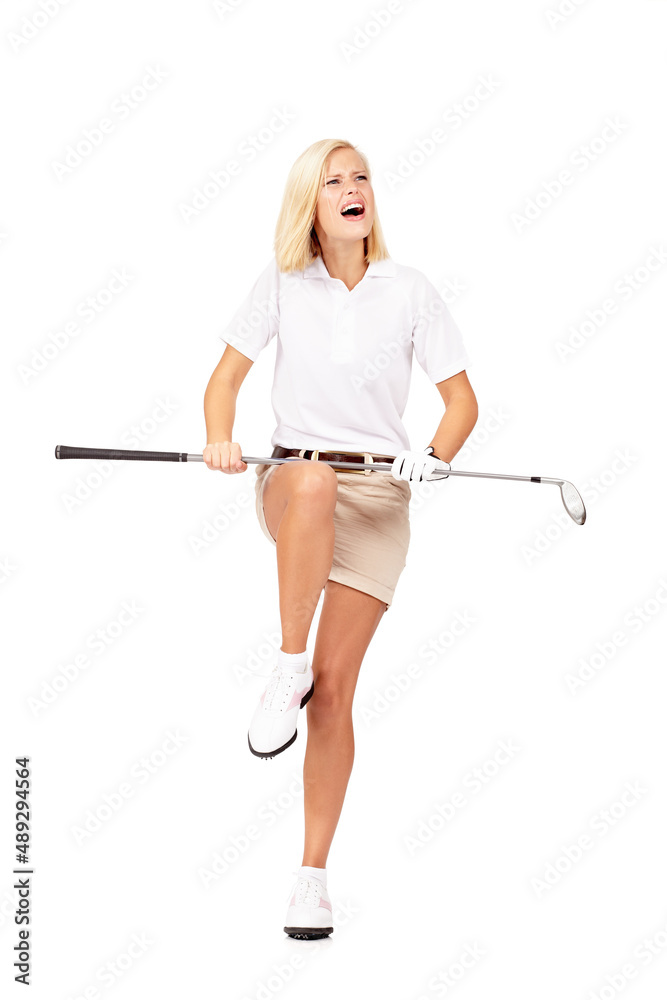 When I get mad, my clubs tend to snap. Studio shot of a young golfer holding her golf club over her 