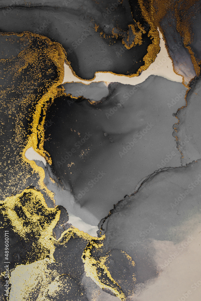 纸上大理石液体水墨艺术画的暗金色抽象背景。原始艺术品的图像