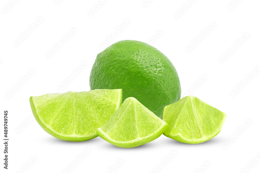 Whole and slices of fresh green lime isolated on white background.