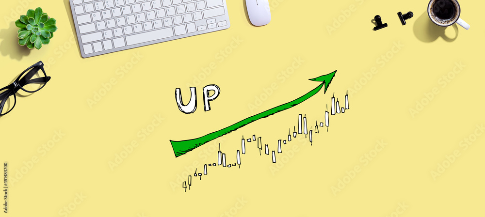 Market up trend chart with a computer keyboard and a mouse