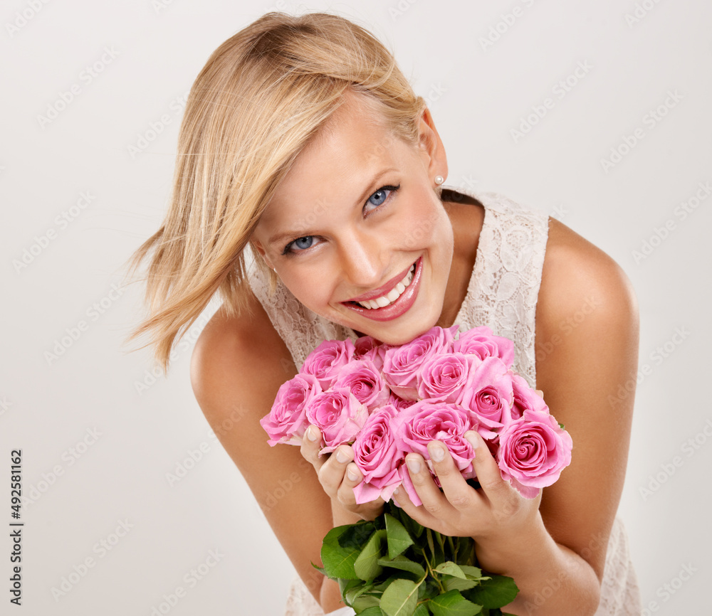 I love my flowers. Portrait of an attractive young woman holding a bouquet of flowers.