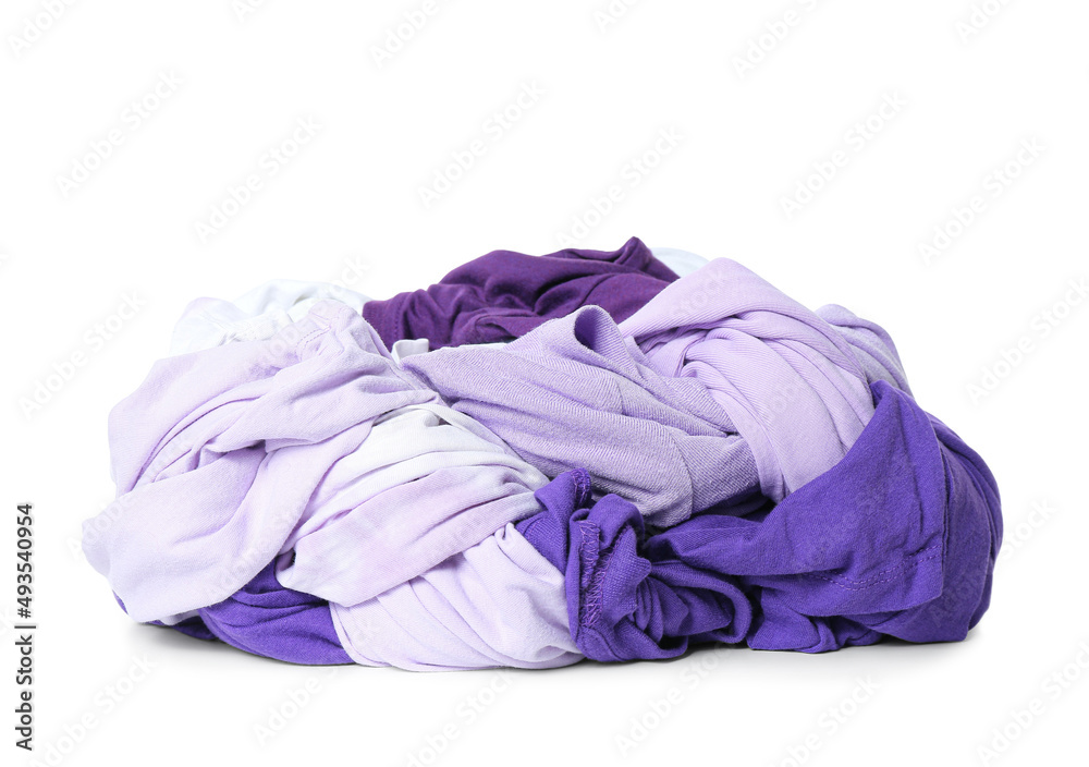 Different crumpled clothes on white background