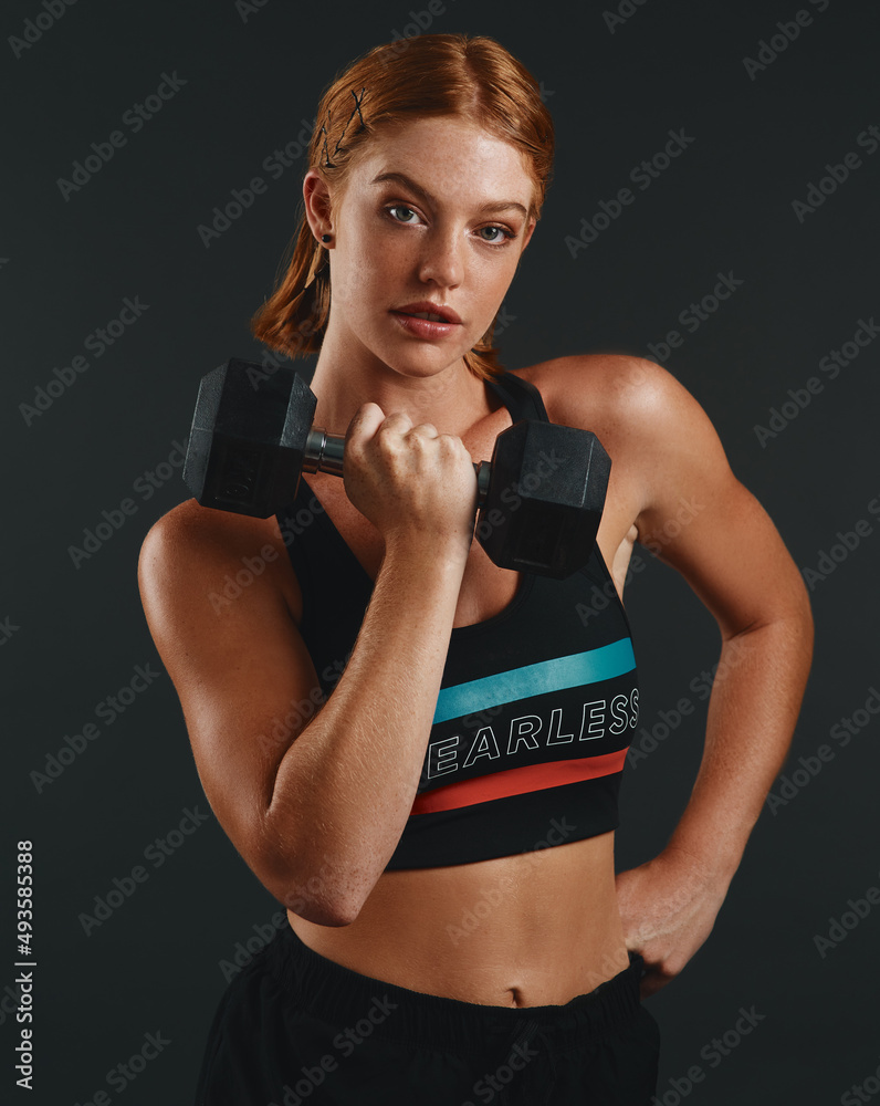 The hardest part about working out should be your muscles. Studio portrait of a sporty young woman e