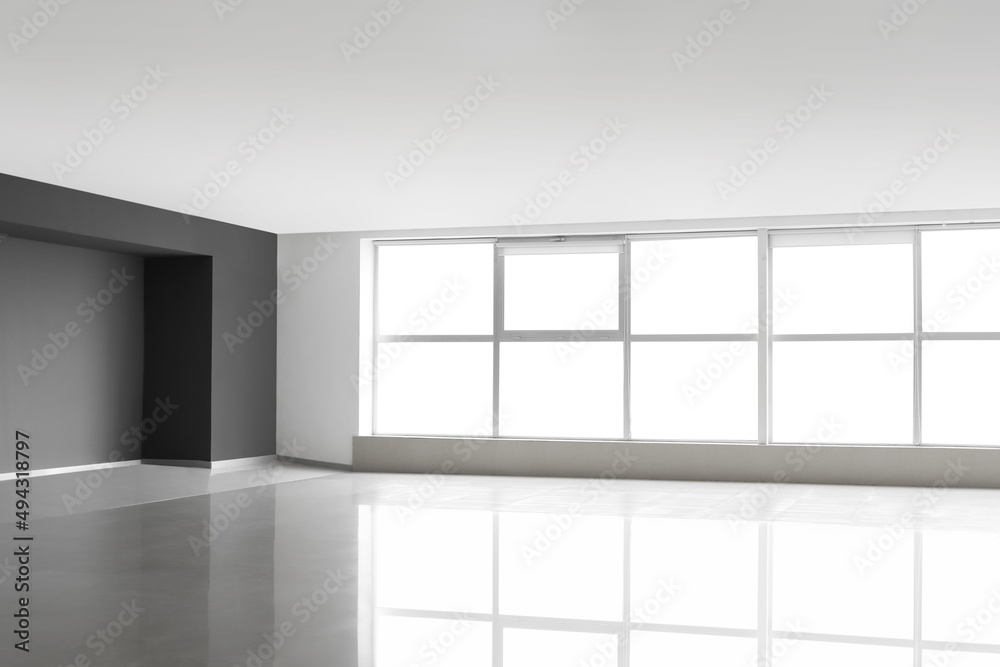 View of big modern empty room with windows