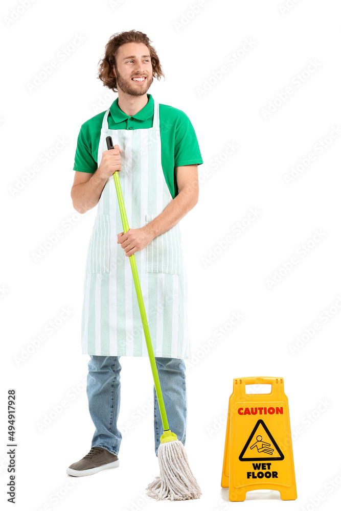 Young worker of cleaning service with mop and caution sign on white background