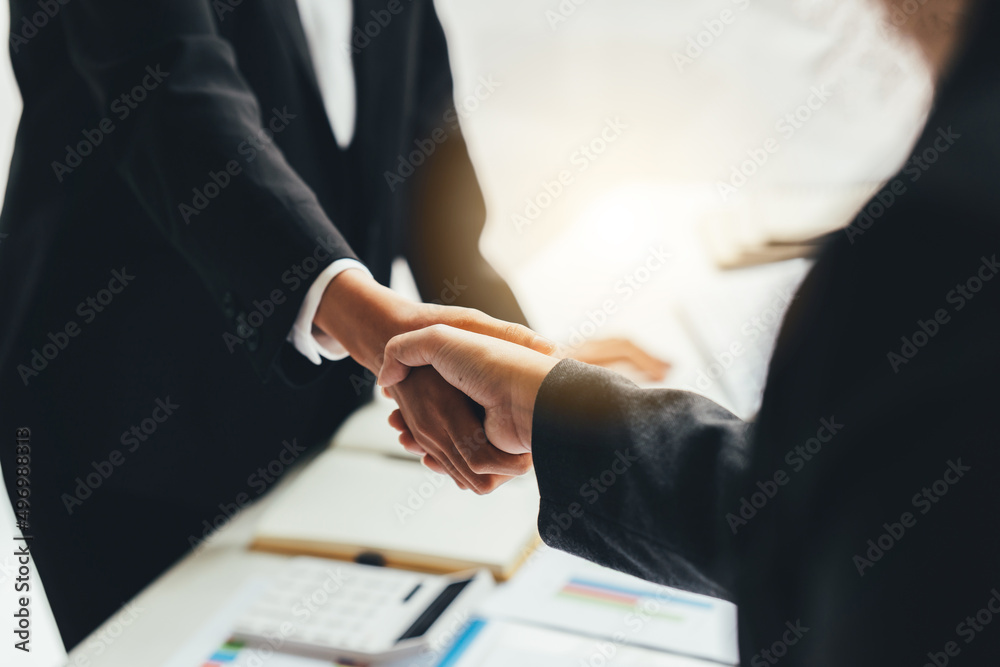 Business people shaking hands, finishing up meeting