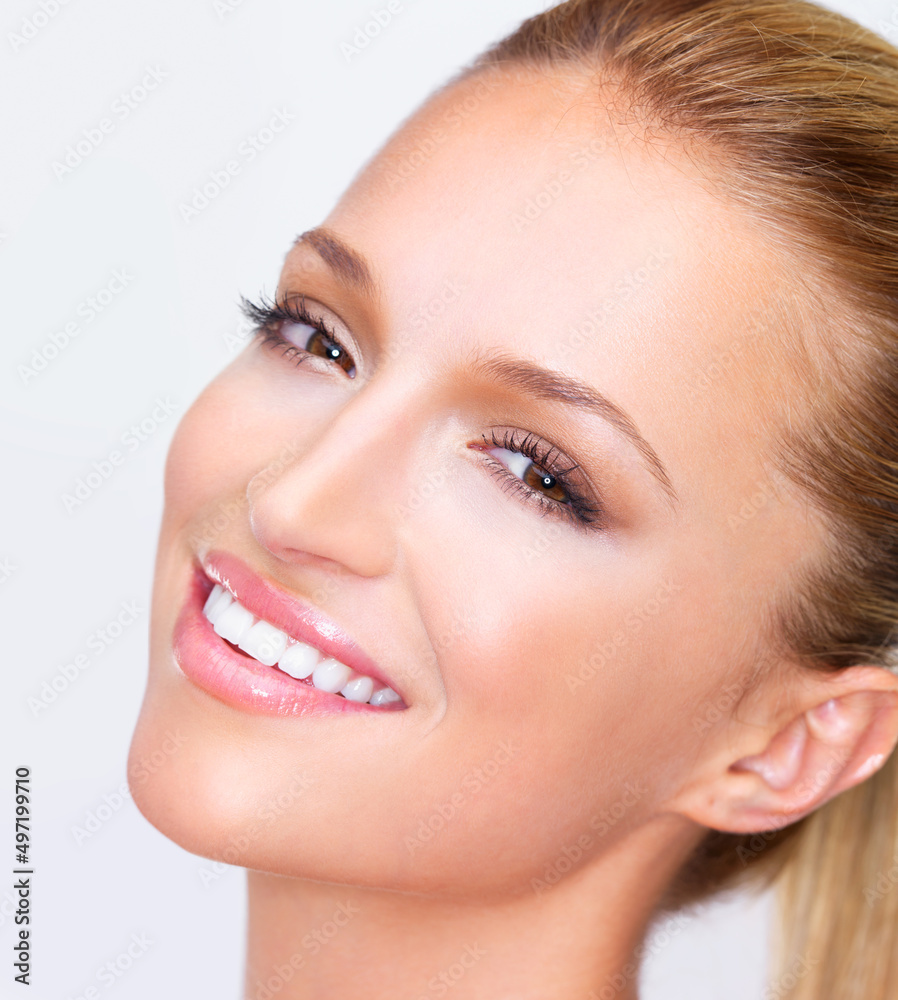 Simply luminous beauty with a beguiling smile. Cropped closeup of a naturally beautiful woman with f