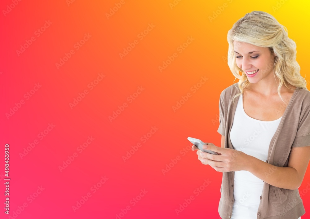 Caucasian woman using smartphone against copy space on yellow and pink gradient background