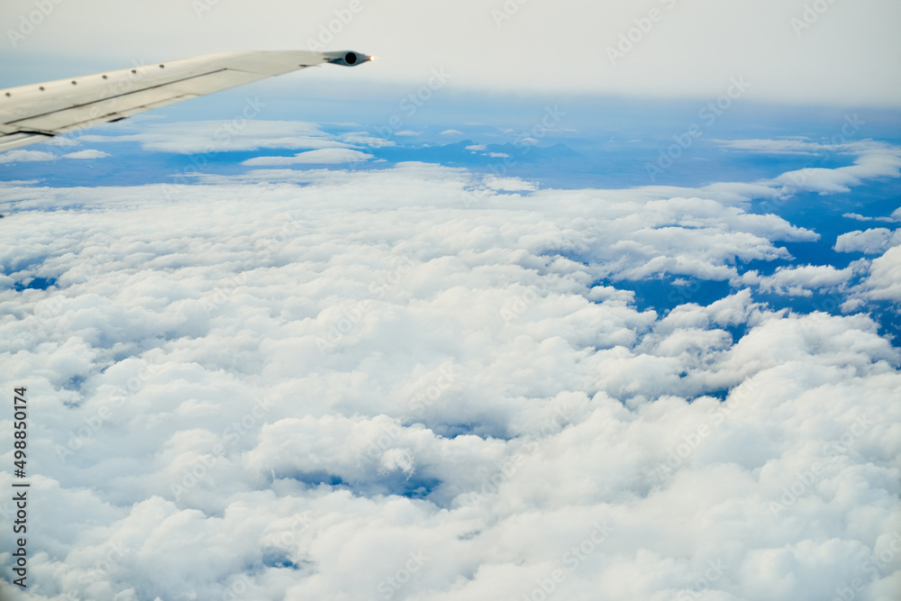 You wont find a better view. Shot of a cloudy view seen from an airplane window.