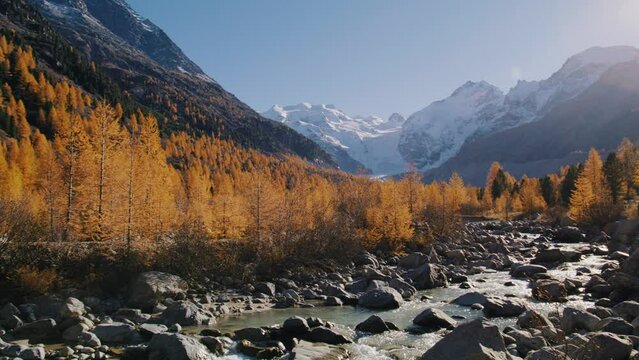 beatiful nature scenery in switzerland with glacier, mountains and river in autumn