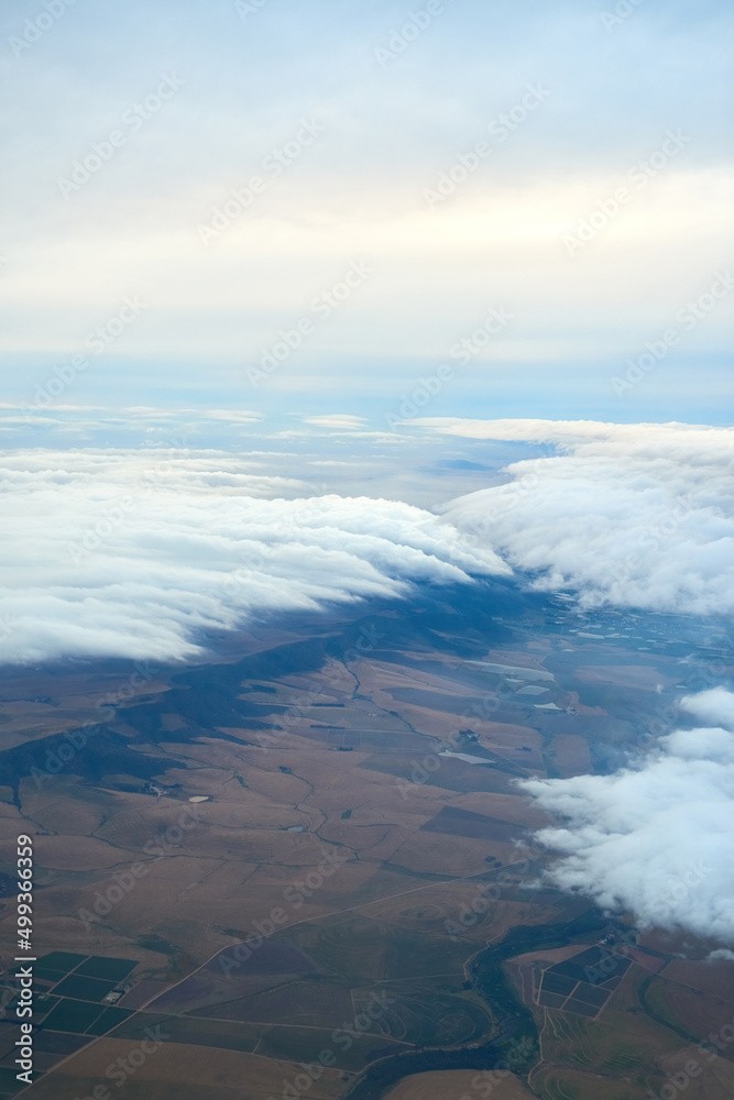 Have you got your head in the clouds. Shot of a cloudy view seen from an airplane window.
