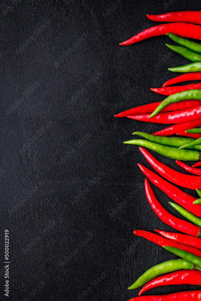 hot chilli pepper pattern on black background top view mock up
