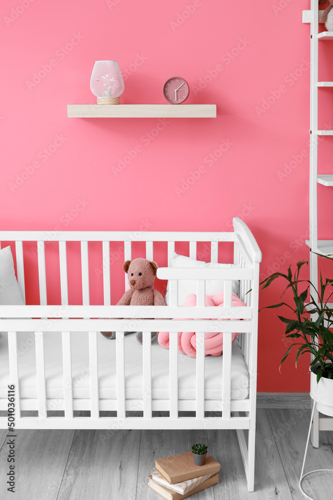 Interior of beautiful childrens room with stylish decor and crib