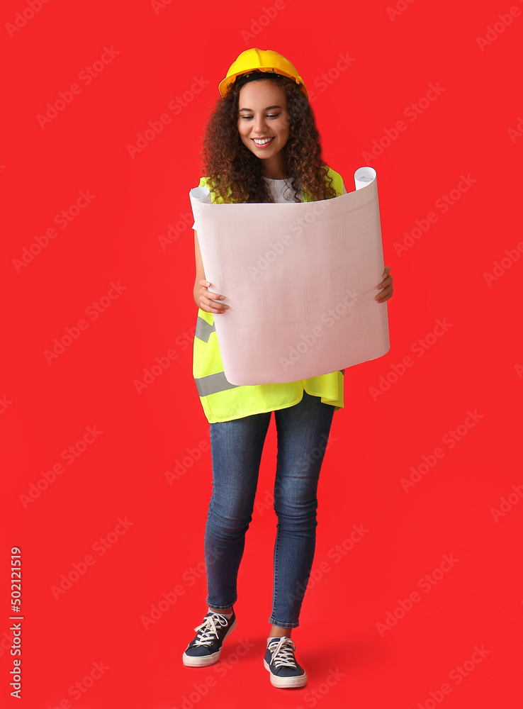 Young female designer with drawings on color background