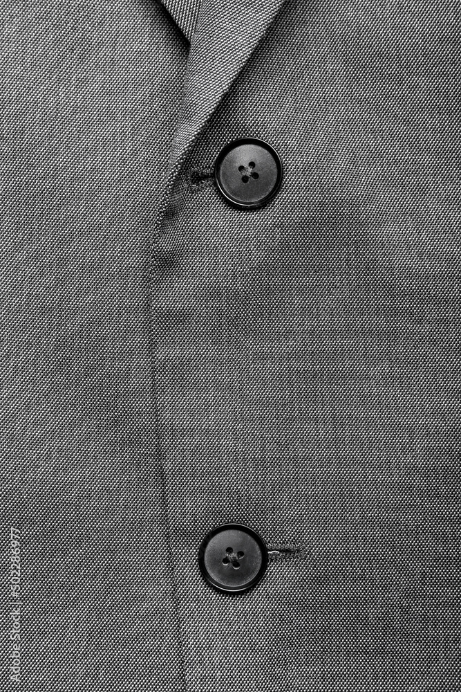 Closeup view of male jacket with black buttons