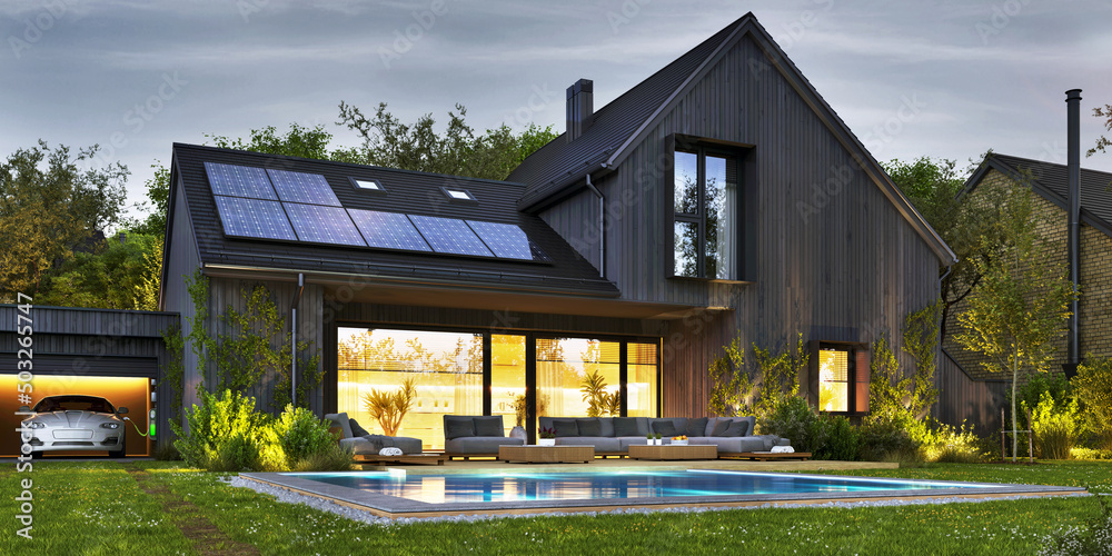 带太阳能电池板和电动汽车的美丽现代住宅夜景