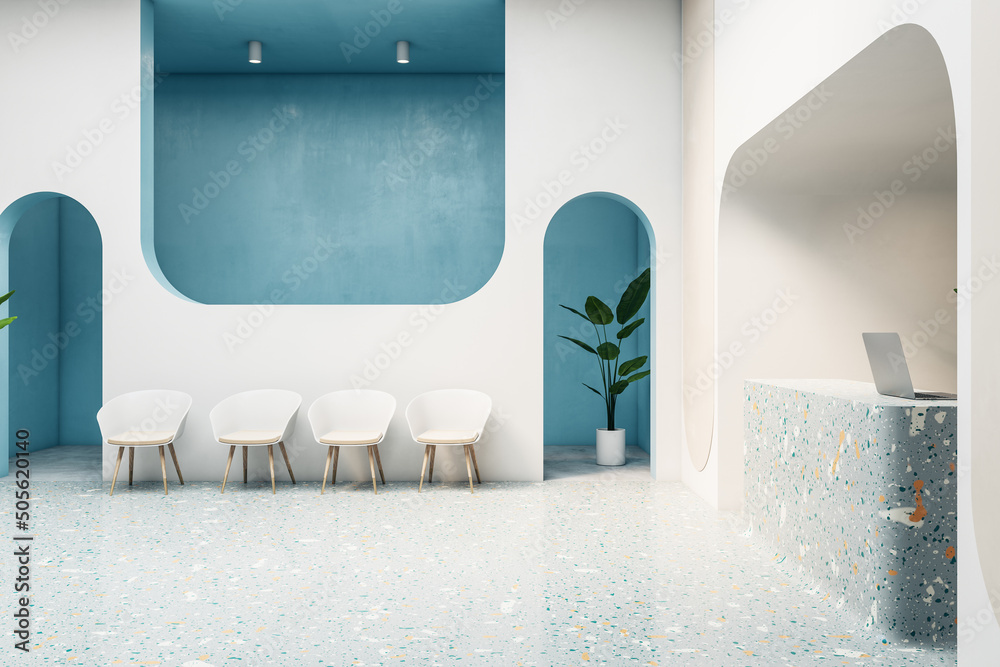 明亮的现代等候区室内设计，蓝色墙壁附近有白色椅子和多色凹槽
