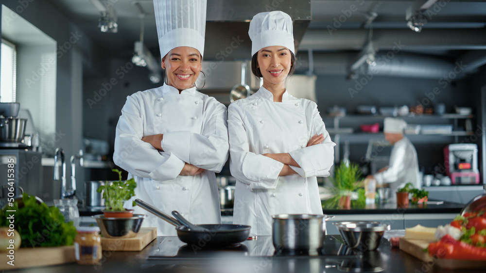 World Famous Restaurant: Portrait of Asian and Black Female Chefs Posing, Looking at Camera.Two Prof